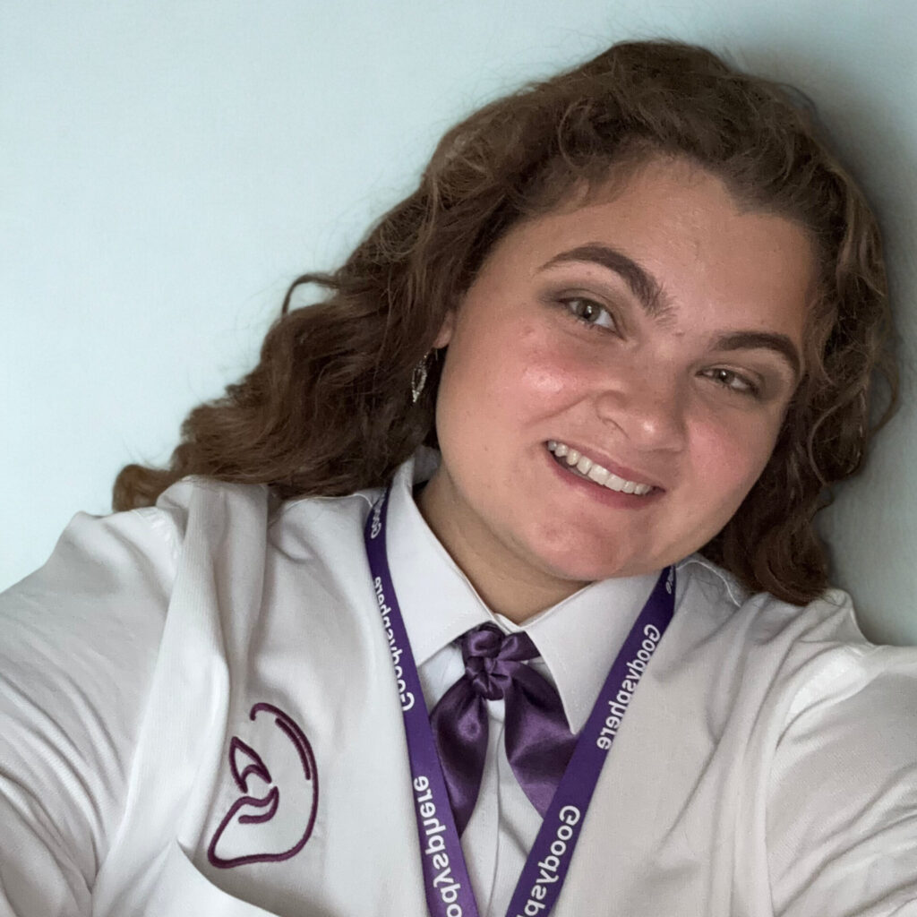Tabitha Goodison smiling at the camera in uniform.