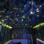 the roof of the mobile sensory unit with foliage across it and interweaved fibre optic lighting.