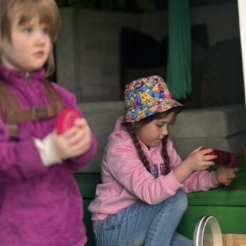 two children engage with sensory toys independently